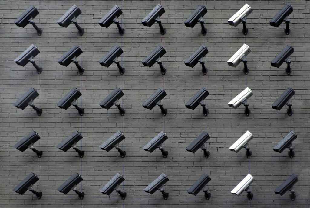 A surveillance camera mounted on a wall